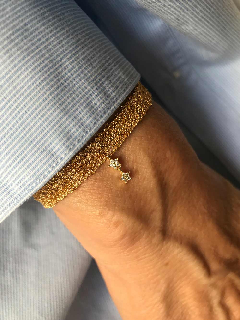 Bracciale catene e stellina doppia creato da Lucillazadra, indossato